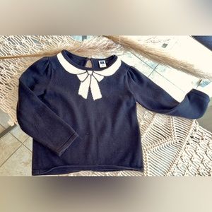 Janie and Jack Girl Sweater, 2 T. Black color with white bow print on it.